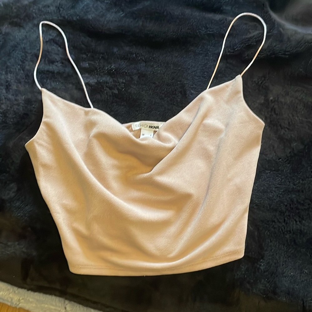 Cropped tan like shirt it’s very cutee .only wore twice